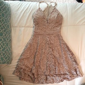 A formal sparkling laced open back dress